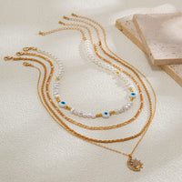 Thumbnail for Boho Layered CZ Inlaid Sun Moon Pendant Evil Eye Pearl Chain Necklace Set - ArtGalleryZen