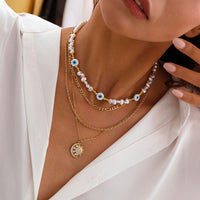 Thumbnail for Boho Layered CZ Inlaid Sun Moon Pendant Evil Eye Pearl Chain Necklace Set - ArtGalleryZen