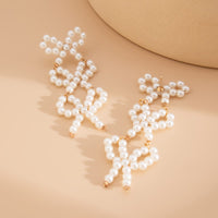 Thumbnail for Charming Pearl Beaded Bowknot Dangle Earrings - ArtGalleryZen