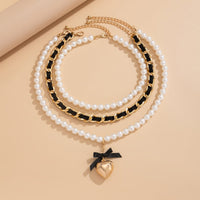 Thumbnail for Chic 3pcs Ribbon Heart Pendant Pearl Chain Velvet Necklace Set - ArtGalleryZen