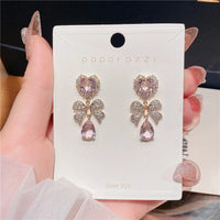 Thumbnail for Chic CZ Inlaid Crystal Ribbon Heart Dangle Earrings - ArtGalleryZen
