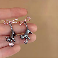 Thumbnail for Chic Pink Crystal Heart Dangling Ribbon Cat Earrings - ArtGalleryZen