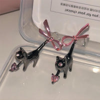 Thumbnail for Chic Pink Crystal Heart Dangling Ribbon Cat Earrings - ArtGalleryZen