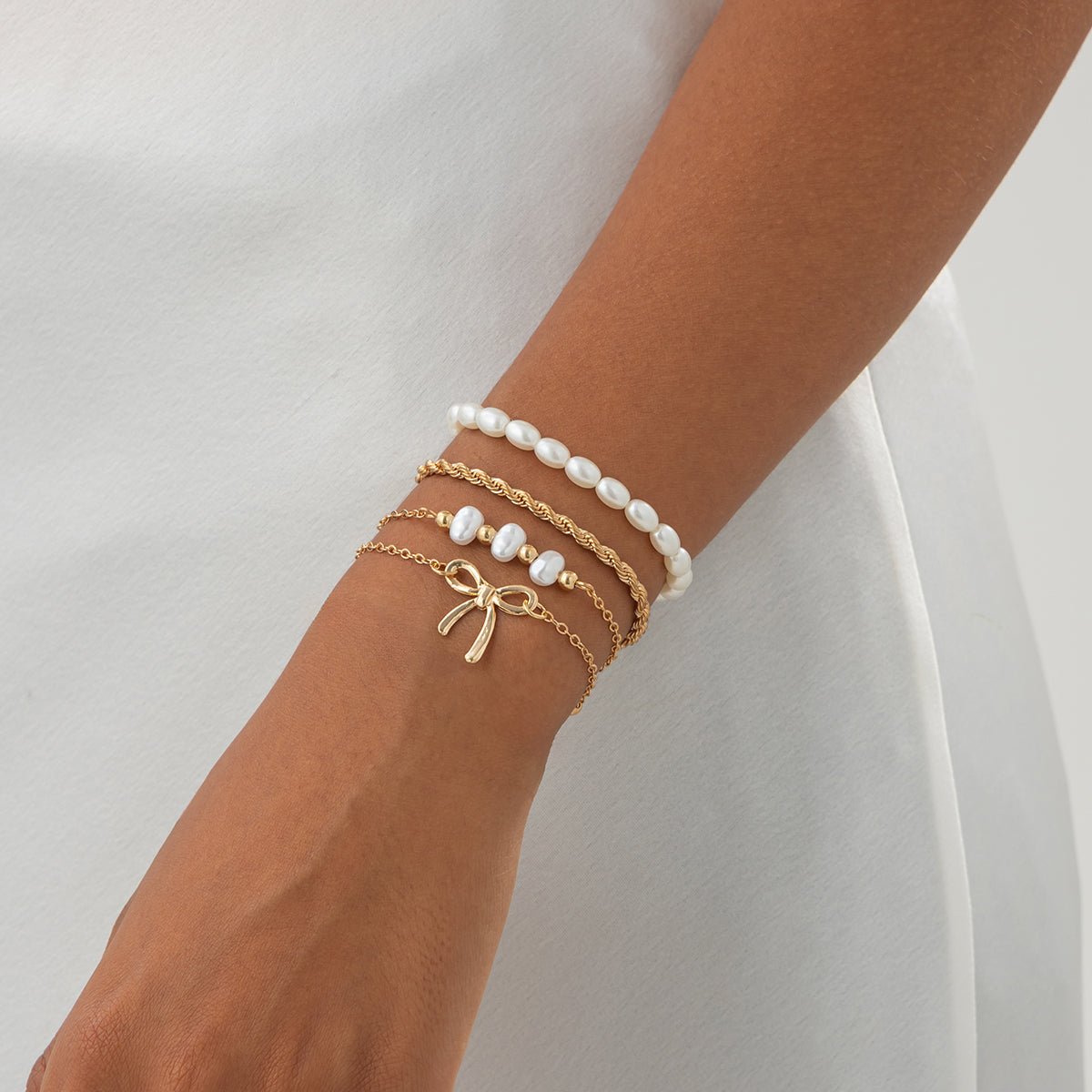 Elegant 4pcs Bowknot Charm Pearl Rope Chain Bracelet Set - ArtGalleryZen
