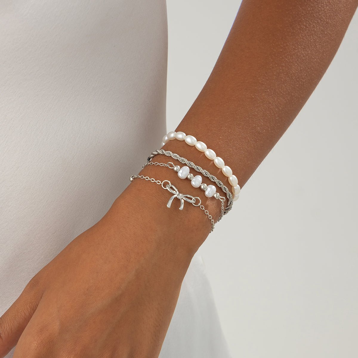 Elegant 4pcs Bowknot Charm Pearl Rope Chain Bracelet Set - ArtGalleryZen