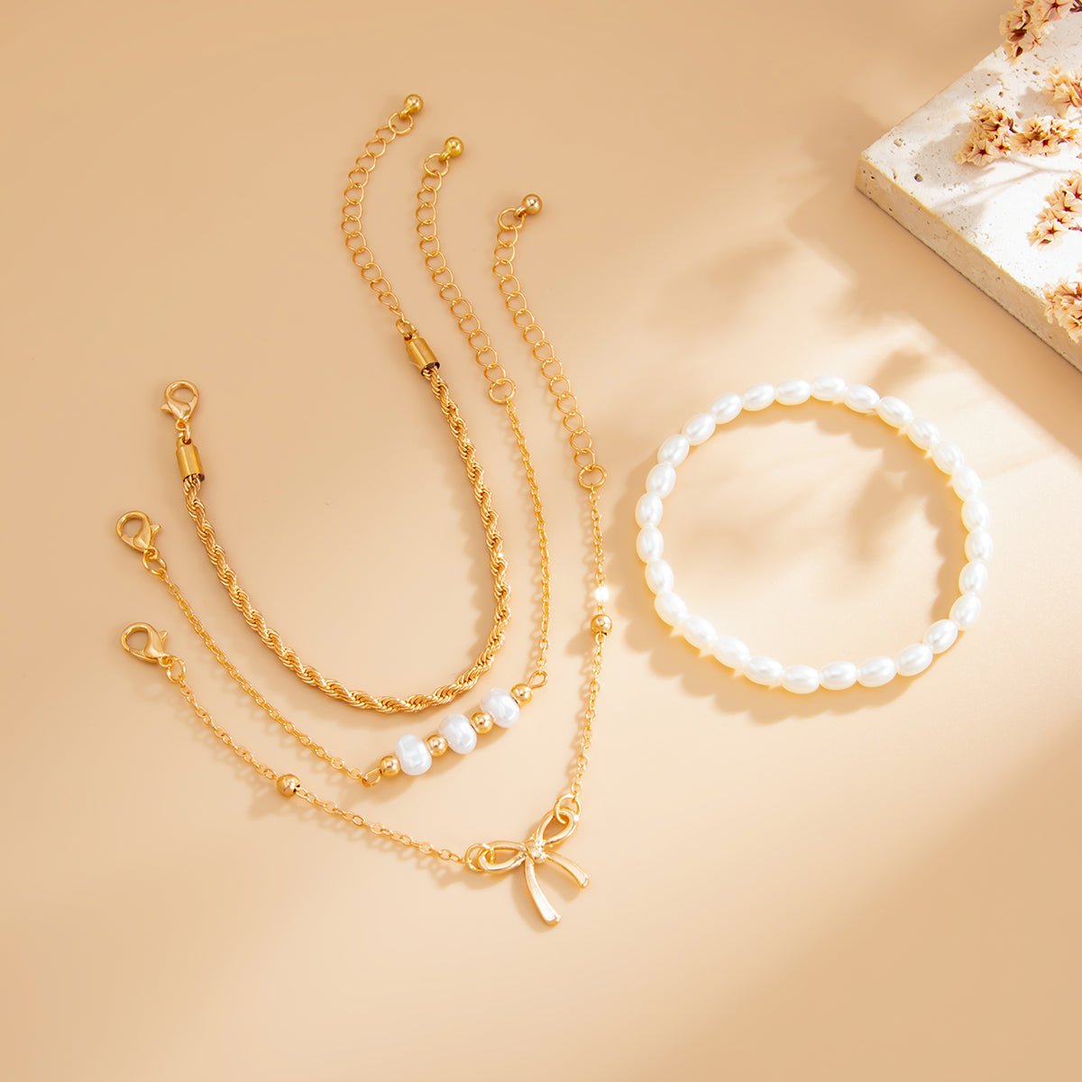 Elegant 4pcs Bowknot Charm Pearl Rope Chain Bracelet Set - ArtGalleryZen