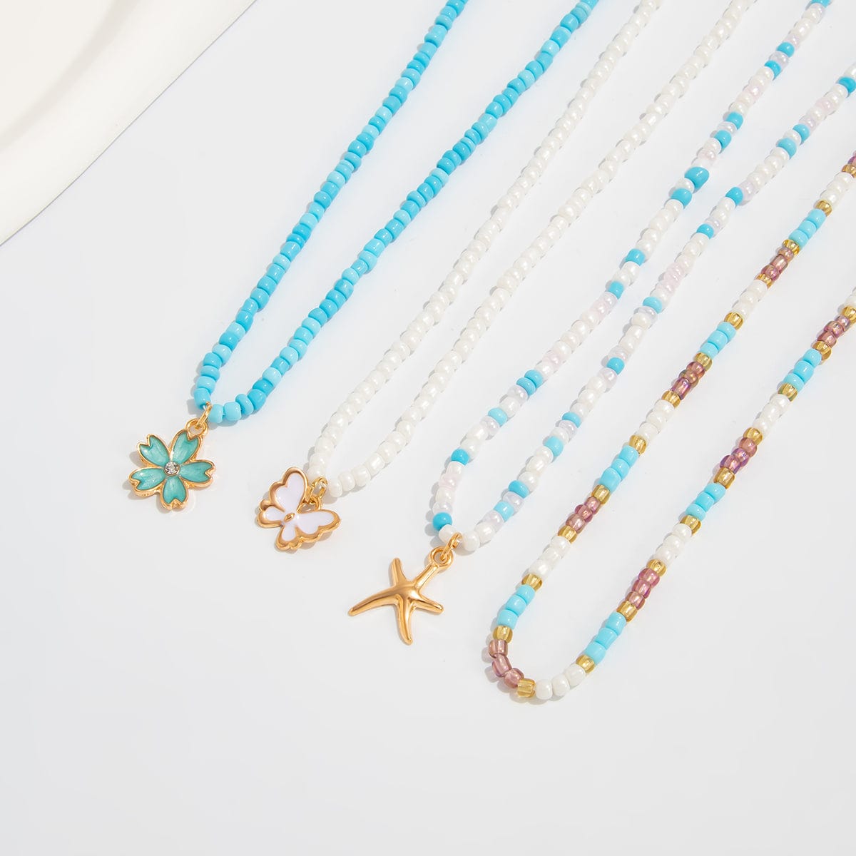 Elegant 4pcs Enamel Butterfly Flower Starfish Pendant Seed Beaded Necklace Set - ArtGalleryZen