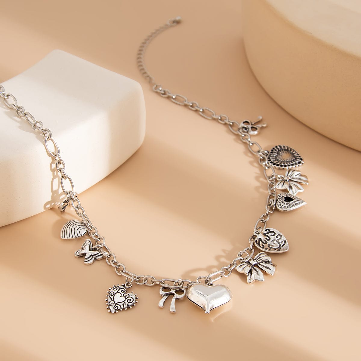 Elegant Gold Silver Tone Relief Heart Bowknot Tassel Necklace - ArtGalleryZen