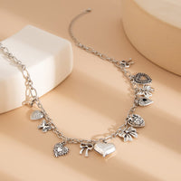 Thumbnail for Elegant Gold Silver Tone Relief Heart Bowknot Tassel Necklace - ArtGalleryZen