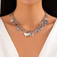 Thumbnail for Elegant Gold Silver Tone Relief Heart Bowknot Tassel Necklace - ArtGalleryZen