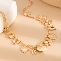 Thumbnail for Elegant Gold Silver Tone Relief Heart Bowknot Tassel Necklace - ArtGalleryZen