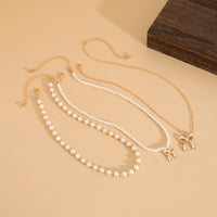 Thumbnail for Elegant Layered Enamel Bowknot Pendant Pearl Chain Necklace Set - ArtGalleryZen