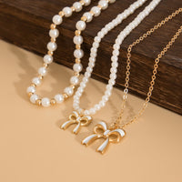 Thumbnail for Elegant Layered Enamel Bowknot Pendant Pearl Chain Necklace Set - ArtGalleryZen