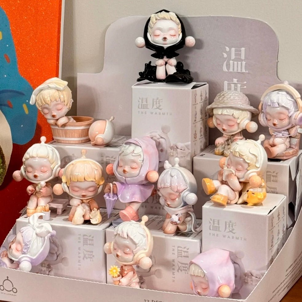 Collection of Pop Mart Skullpanda small figurines on display with a neutral background