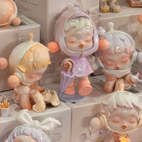 Thumbnail for Collection of Pop Mart Skullpanda small figurines with a focus on a central figure holding an umbrella.