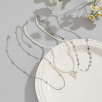 Thumbnail for Trendy Layered Bowknot Charm Star Pearl Chain Necklace Set - ArtGalleryZen