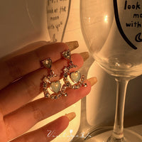 Thumbnail for Chic CZ Inlaid Cupid Arrow Heart Dangle Earrings - ArtGalleryZen